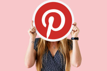 Woman showing a Pinterest icon