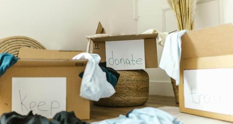 A group of boxes with clothes on the floorAI-generated content may be incorrect.