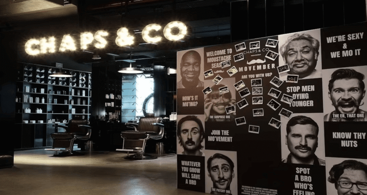 Men's faces artwork decorating a salon wall