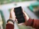 Person holding a smartphone for Android file